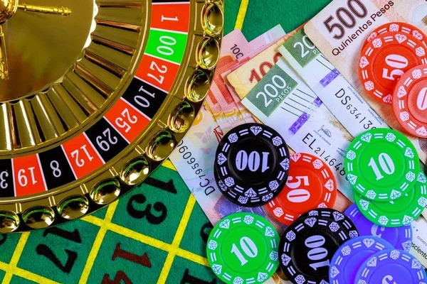 Live dealer studio with Sic Bo table and three dice visible